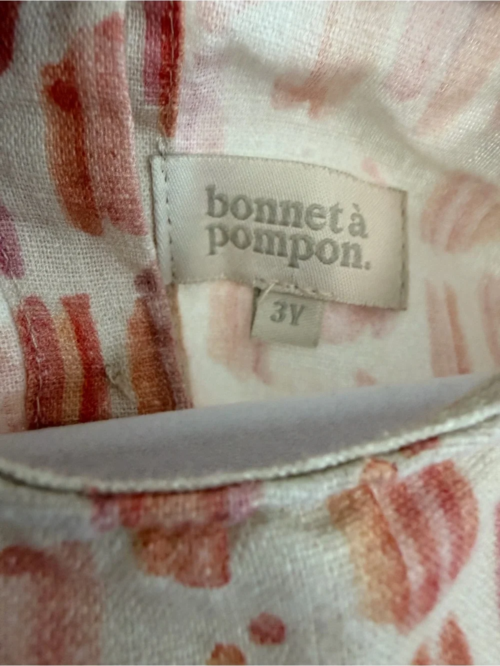 Bonnet a Pompon Linen Flutter Sleeve Top with Pink & Orange Brushstroke Print